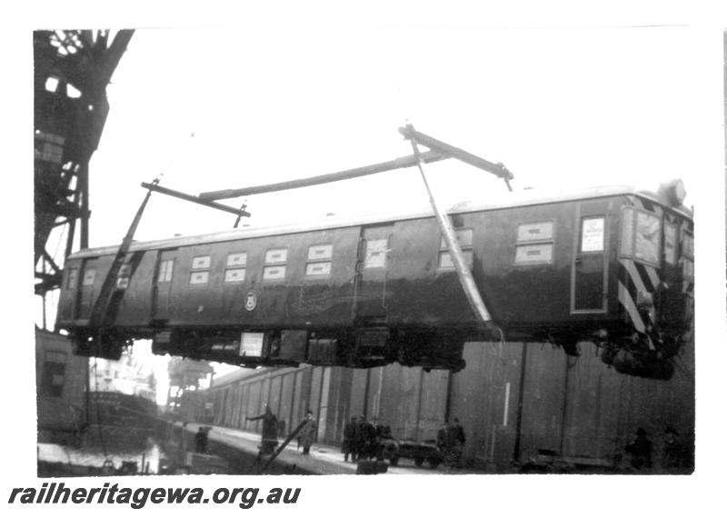 P07744
3 of 4 views of ADG class railcar on docks at Liverpool, UK being loaded on to ship
