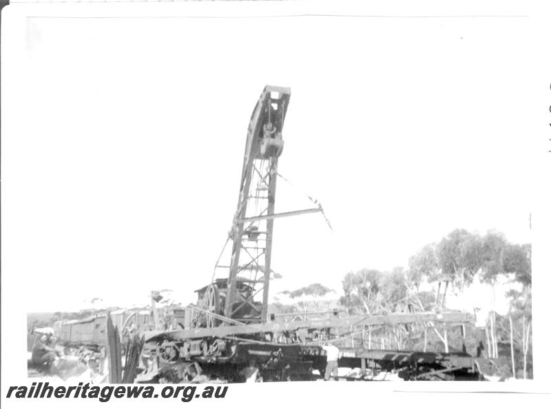 P07753
4 of 6 views of a derailment at Norseman, CE line on 31.1.1962. Ted Bosworth was the Officer In Charge of the Breakdown crew. Crane No.23 lifting derailed wagon
