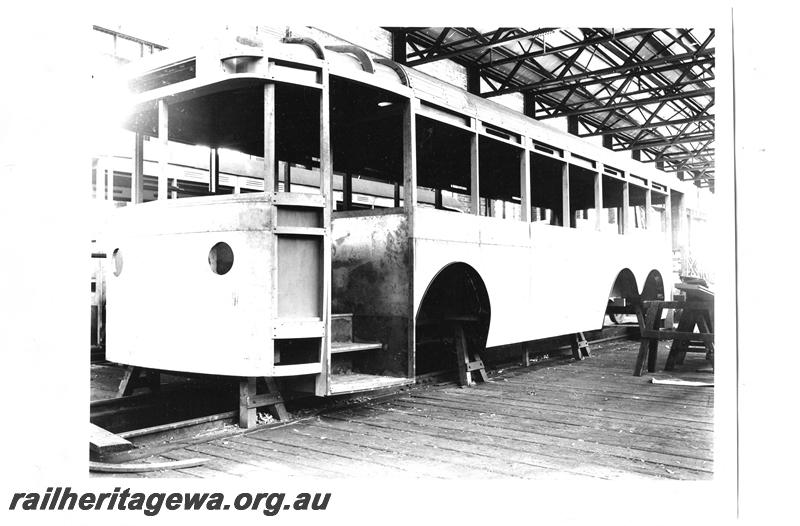 P07768
WAGT J class six wheel trolley bus, under construction, Midland Workshops, front and side view.
