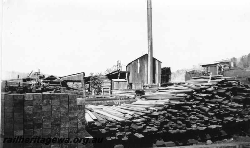 P08050
Timber mill, Argyle, shows timber stacks and Shay loco in background
