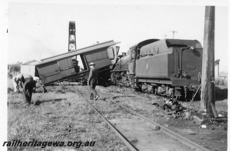 P08137
6 of 7 views of the collision at Yarloop, SWR line, by a train headed by W class 951 and a stationary goods train. shows tender of W class 951 and side of Z class 65 clerestory roofed brakevan across the track
