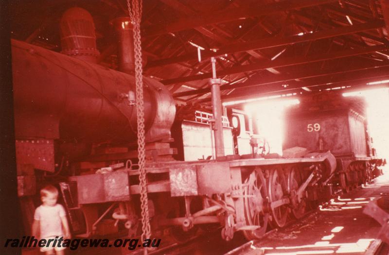 P08239
Millars loco No.58, Yarloop Workshops, loco under repair, internal view of workshop, tender of No.59 in view.

