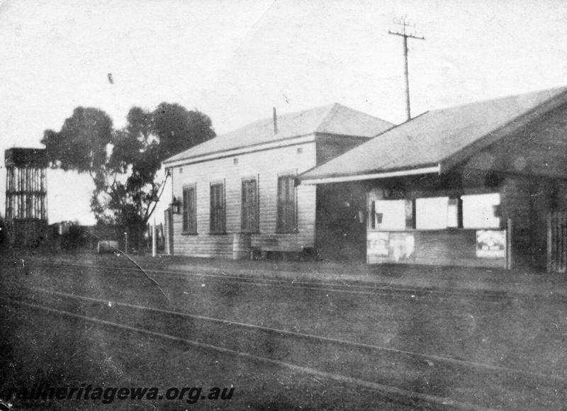 P08691
Station buildings, water tower, dining room (later the SM office) & bar, Buntine, EM line, trackside view. (ref: SRO file Acc1642/736) 
