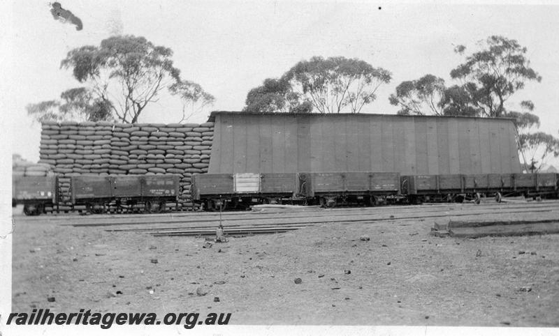 P08743
Open wagon, large storage shed with bagged wheat, Unknown location but could be on the CM line, same location as P5268
