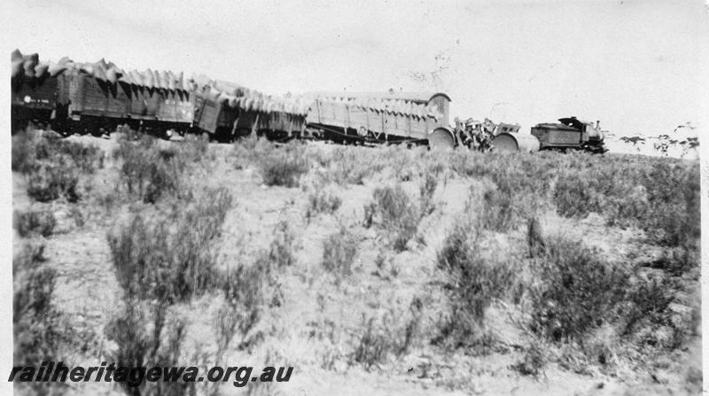 P08746
C class loco derailed wagons loaded with bagged wheat, location Unknown but possibly on the CM line.
