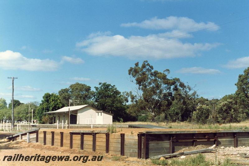 P08794
1 of 4 views of the loading platform and station buildings at Mundijong, SWR line, view across yard to the station
