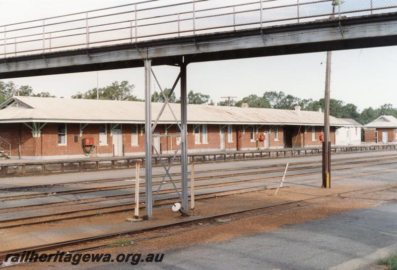 P08803
Footbridge, station buildings, Narrogin, GSR line, view across yard to station.
