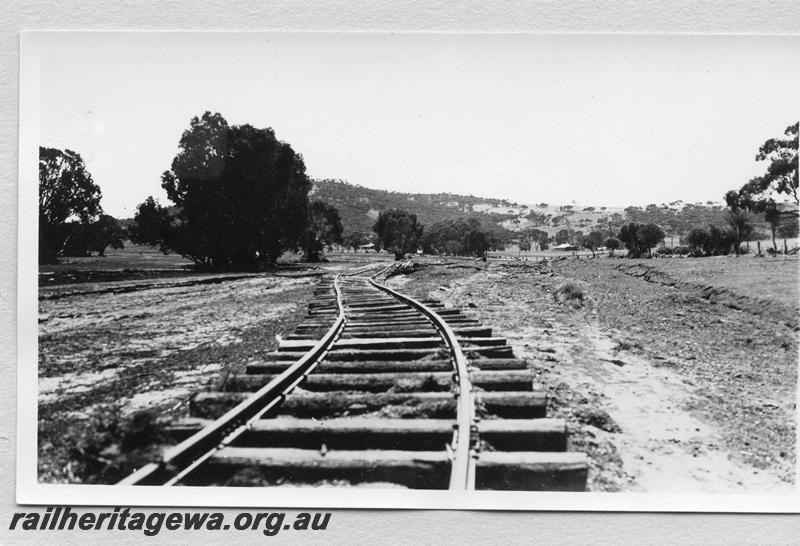P08865
1 of 15 views of the aftermath of the washaway at Coondle, CM line on the 3rd of March 1934, view shows displaced track with exposed sleepers
