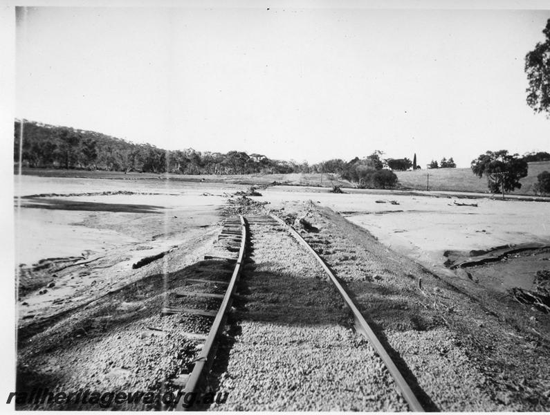 P08868
4 of 15 views of the aftermath of the washaway at Coondle, CM line on the 3rd of March 1934, view of the washaway location looking down the track towards the washaway
