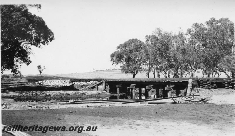 P08870
6 of 15 views of the aftermath of the washaway at Coondle, CM line on the 3rd of March 1934, trestle bridge with its rails on the river bed. Pigsty temporary bridge in the background
