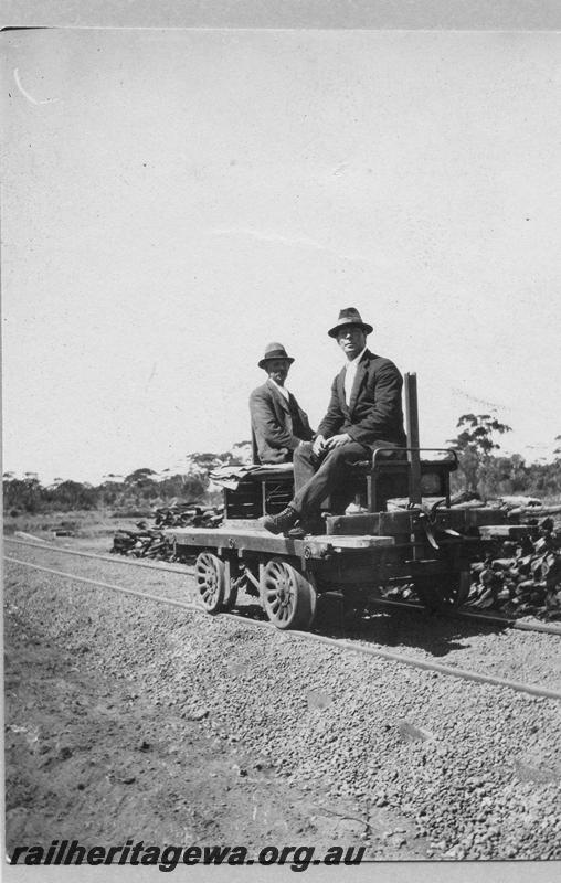 P08894
10 of 29 views of the construction of the Wyalkatchem-Lake Brown-Southern Cross railway, WLB line. Two well dressed men sitting on a gangers trolley
