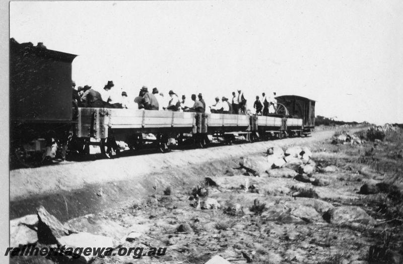 P08901
17 of 29 views of the construction of the Wyalkatchem-Lake Brown-Southern Cross railway, WLB line. Work train consisting of 3 H class wagons and a 4 wheel brakevan, with workers in the wagons
