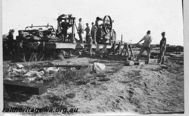 P08904
20 of 29 views of the construction of the Wyalkatchem-Lake Brown-Southern Cross railway, WLB line. Trucking the adzer on a QA class flat wagon
