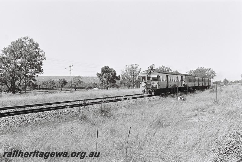 P09069
ADG class railcar on four car set, Armadale line heading towards Perth, front and side view
