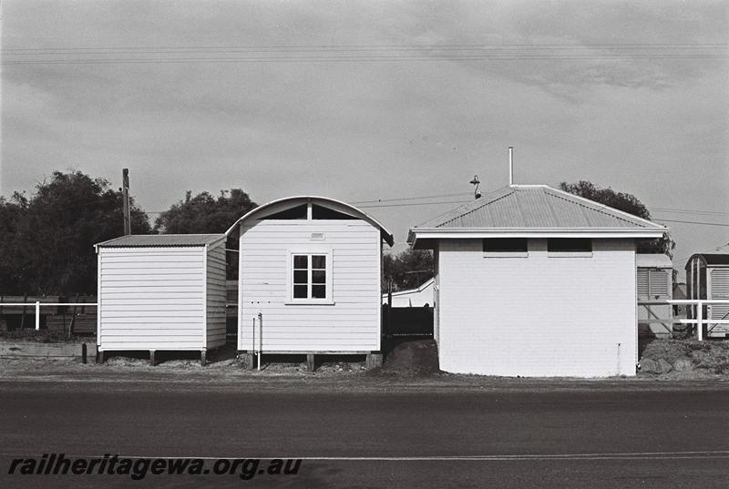 P09132
Ancillary station buildings, Busselton, BB line, toilet, round roofed shed and skillion roofed shed, rear view taken from the street. 
