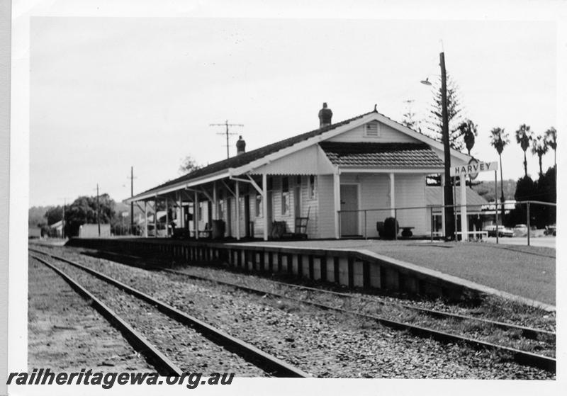 P09406
Station buildings, platform, nameboard, Harvey, SWR line, view from rail side.
