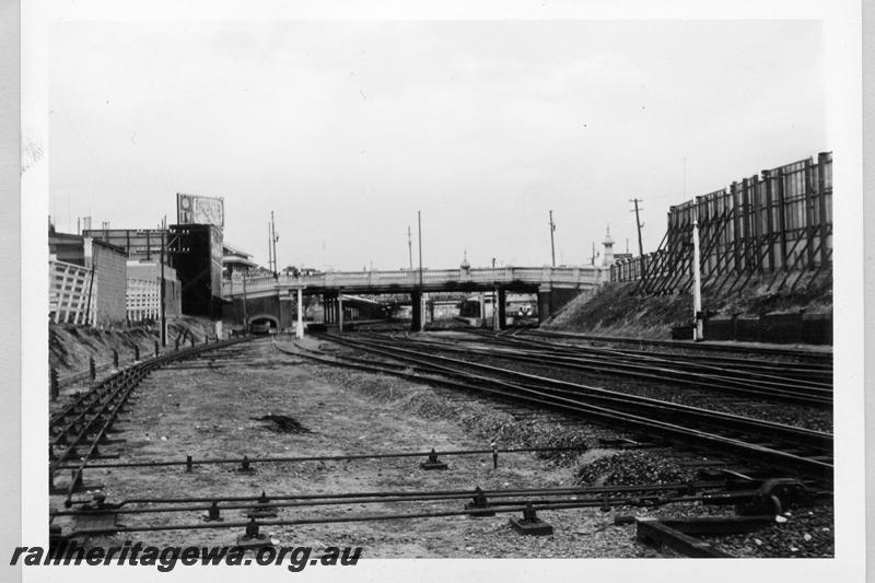 P09441
Perth, eastern approach, looking west, buildings, platforms, signal box, signals, overbridge, point rods, railcar in siding. ER line.
