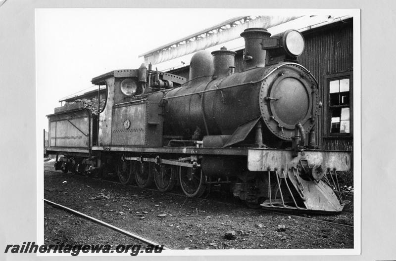 P09470
OA class 5 2-8-0 at Geraldton loco, renumbered 172 in 1949, Note headlight with number boards. Goggs No. 64.
