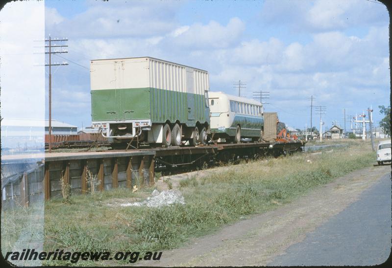 P09604
Piggyback loading at Midland loading ramp between Midland Junction station and Midland Marshalling Yard. ER line. Railway Road Service bus on one of the flat wagons
