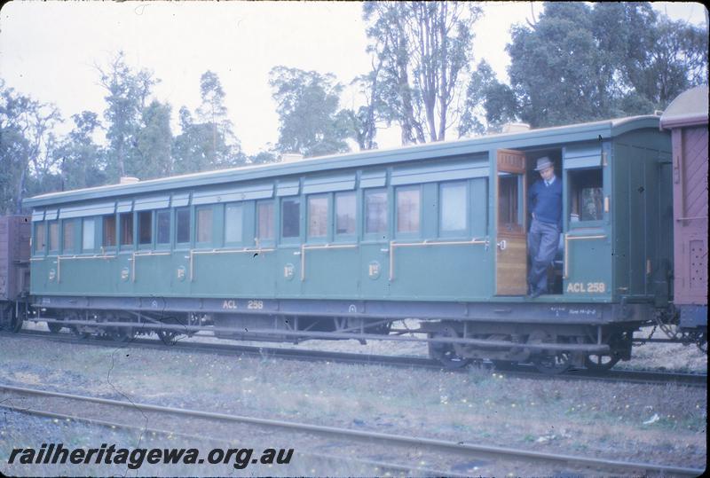 P09653
ACL class 258 carriage on rear of goods train, Moorhead, Peter Nugent in carriage door. Coach attached special Collie to Bunbury. BN line.
