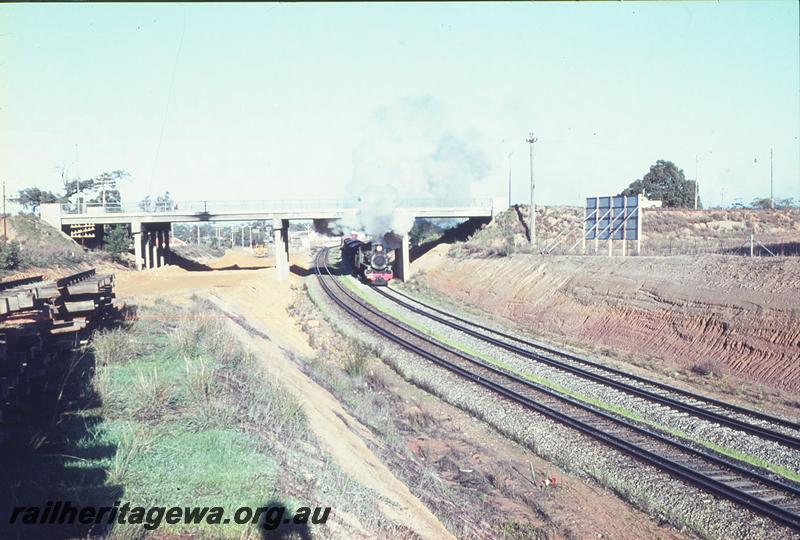 P09670
PMR class 734, down goods on Avon Valley route, Great Eastern Highway overbridge, formation of Parkerville line on left, with stacked track panels, north of Bellevue. ER line.
