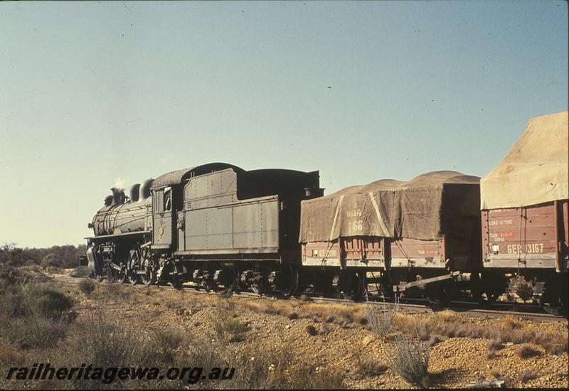 P09769
PR class 522 'Avon', goods train, tarpaulins on ridge poles, north of Bruce Rock. NWM line, GER class 13167 in consist.
