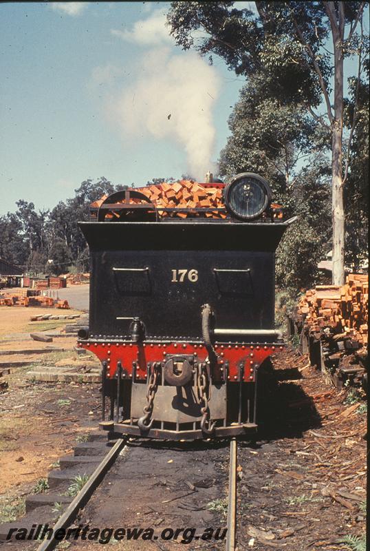 P09918
YX 176, rear view, Donnelly River Mill, timber fuel stacks for loco.
