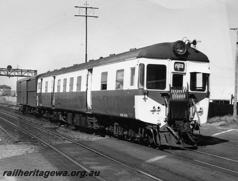 P10381
ADG class 618 suburban diesel railcar with louvre van, on an all stations to Cannington service approaching the Lord Street level crossing, East Perth, This was a regular daily service with a louvre van for parcels traffic to Cannington. note the open doors on the railcar, side and front view.
