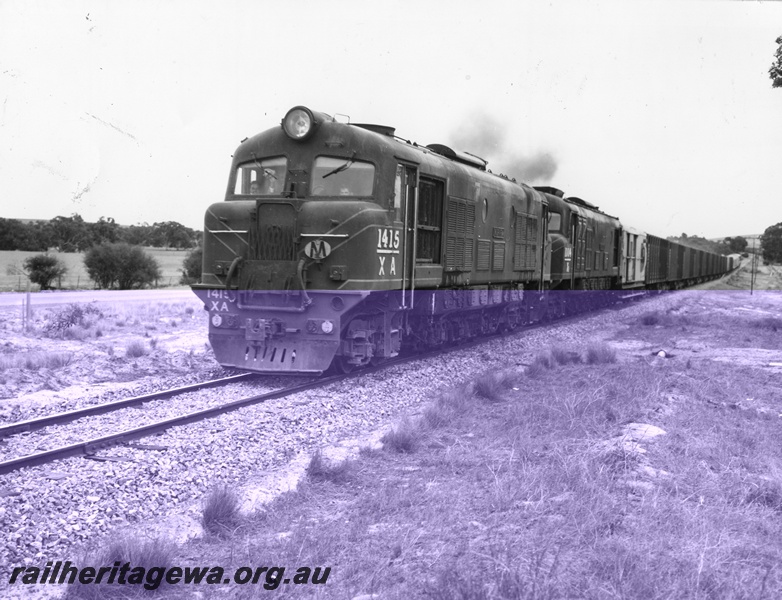 P10404
XA class1415 and XB class1004 hauling a rake of bogie livestock wagons. Unidentified rollingstock at rear of train.
