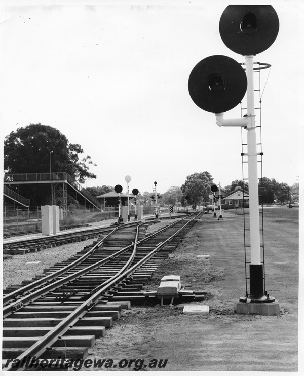 P10422
Section of dual gauge track, automatic signals at Guildford Training Centre. Guildford station and footbridge in left background.
