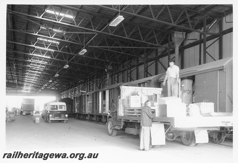 P10562
TNT transfer shed at Kewdale showing goods being loaded into various wagons.
