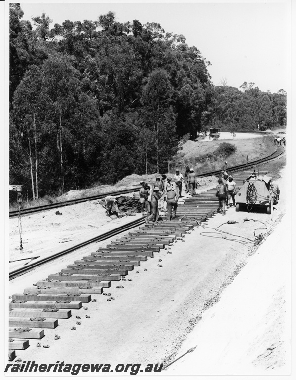 P10652
Line straightening operations, sleepers set out, track laying crew, compressor, jackhammers, near Collie, BN line
