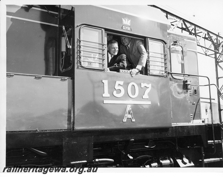 P10705
A class 1507 diesel locomotive, the first built wholly in Western Australia, with Charles Court, Minister for Transport, in the drivers seat at Comeng Works Bassendean.
