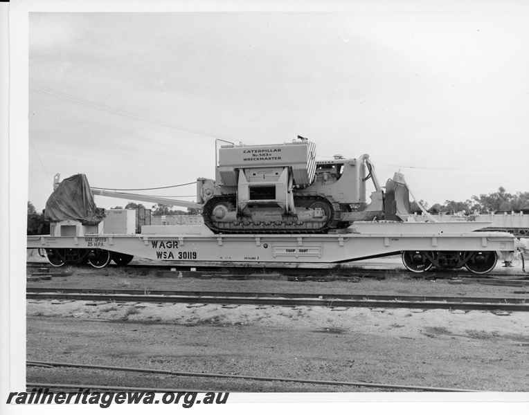 P10718
Caterpillar 583H Wreckmaster loaded on WFA class 30119 standard gauge flat top wagon. This was the standard gauge breakdown/derailment recovery unit based at Forrestfield.
