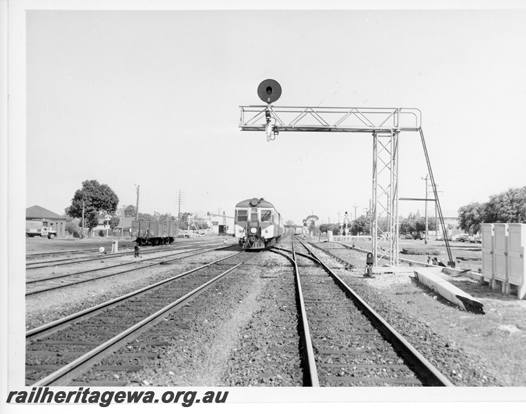 P10728
A suburban railcar set arriving at Maylands enroute to Perth. Note the signal gantry, goods sidings, crane and goods shed.
