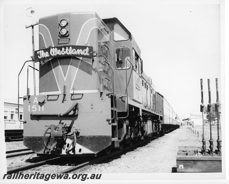 P10767
A class 1511 narrow gauge diesel electric locomotive at the head of The Westland Express at Cunderdin.
