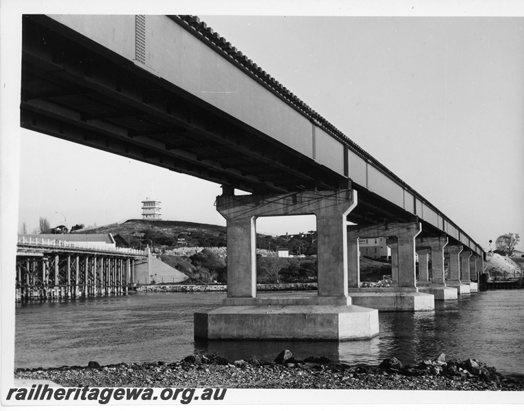 P10772
The new railway bridge over the Swan River at North Fremantle. The road traffic bridge is to the left and the Harbour Control tower is on the hill in the background.
