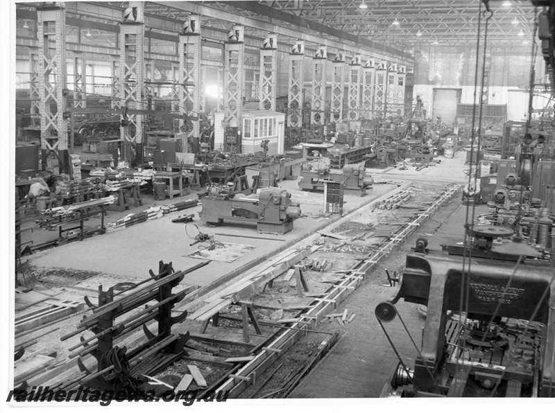 P10811
Replacement of wooden with concrete floor in progress, machinery, workers, Machine Shop, Midland Workshops, overview from elevated position
