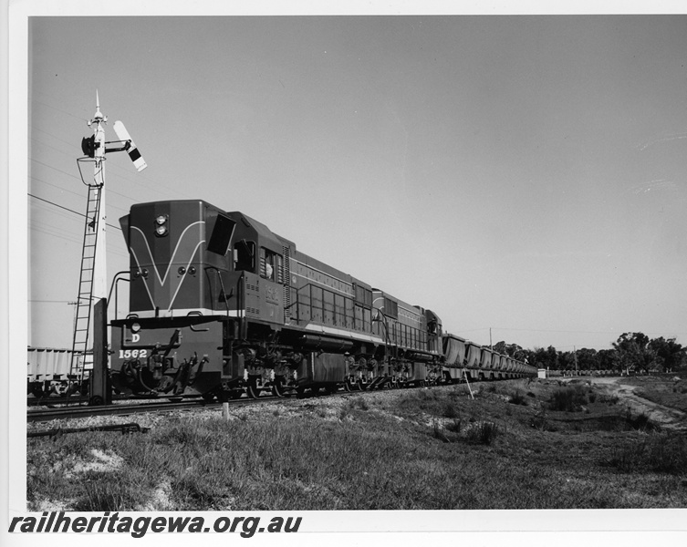 P10816
D class 1562 and another D class diesel, double heading  loaded  bauxite train,  semaphore somersault signal entering Kwinana Yard, front and side view
