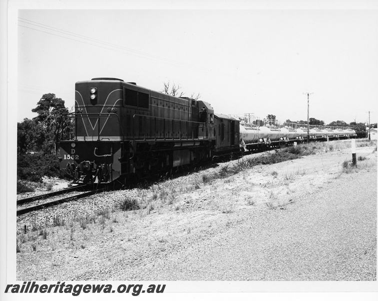 P10824
D class 1562, on goods train comprising van and tanker wagons, end and side view
