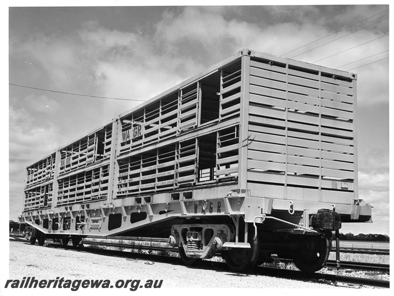 P10833
WFX class flat wagon with three sheep containers including No 5306, black and white version of P04428, side and front view
