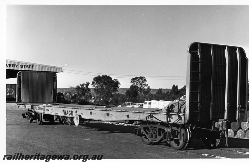 P10835
WGX class 33100 flat wagon with high ends, rural setting, side and end view
