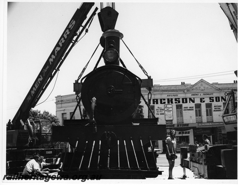 P10838
Placement of R class 174 on display outside Centerpoint No 3 of 3 images, loco (front view) being lowered into position by 