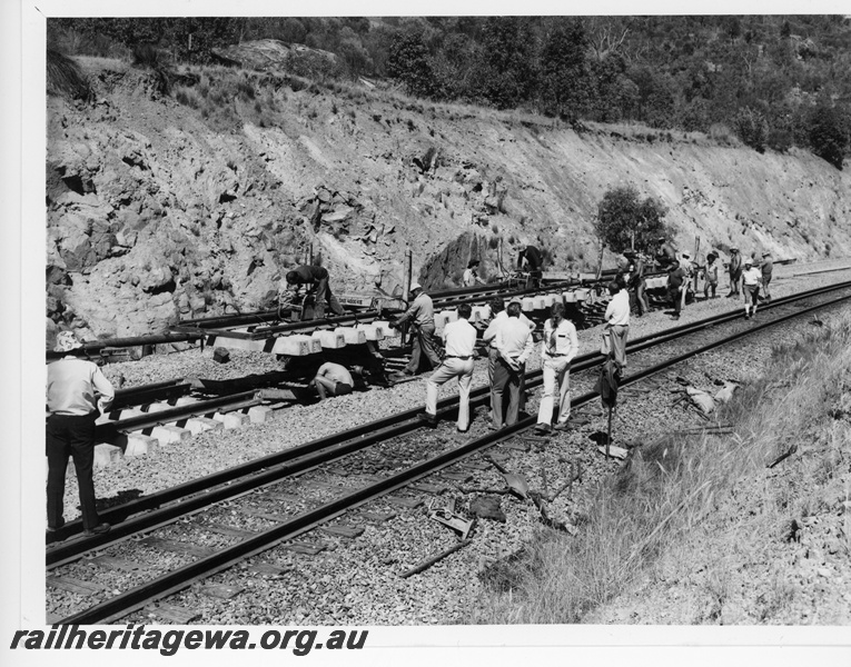 P10848
Standard gauge construction, laying dual gauge tracks in cutting, workers, onlookers, Avon Valley line, c1964
