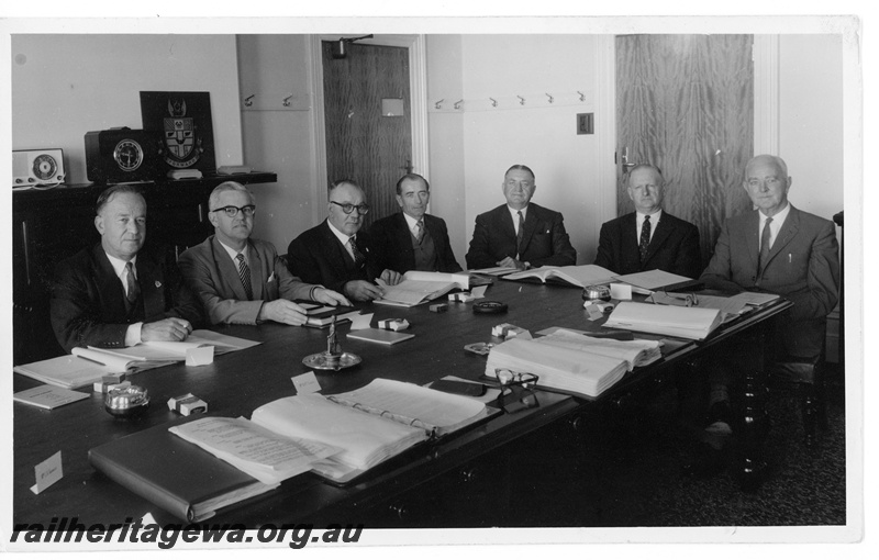 P10861
Group photo of WAGR executives, including Mr. C. G. C Wayne, Commissioner of Railways (1959-1967) (pictured 5th from left), in meeting room, table level view
