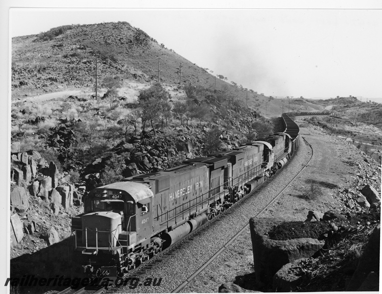 P10893
Hamersley Iron (HI) M636 class 4047, 4051, 4046 haul an empty train through Bells Cutting near Tom Price.
