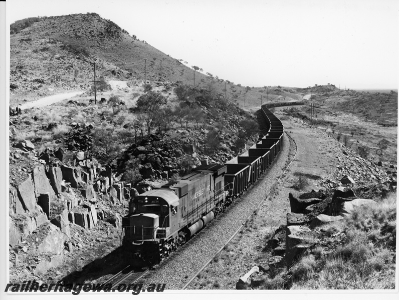 P10903
Hamersley Iron (HI) M636 class 4034 hauls an empty ore train through Bells Cutting.
