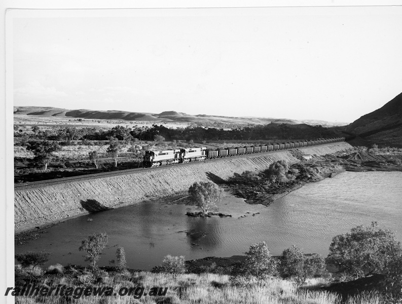 P10910
Cliffs Robe River (CRRIA) M636 class 1715, 1716 haul loaded iron ore train near Western Creek.
