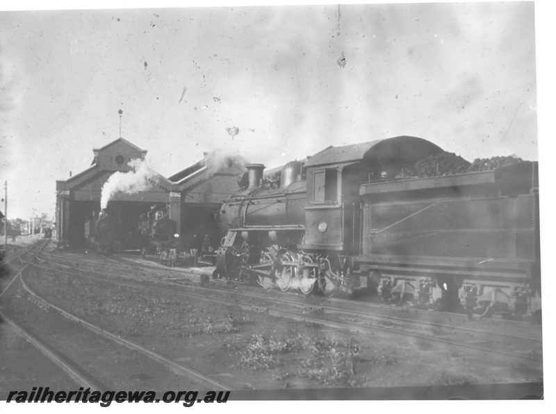 P10915
F class 453 steam locomotive at East Perth Locomotive Depot with two unidentified steam locomotives. Good side view of locomotive.
