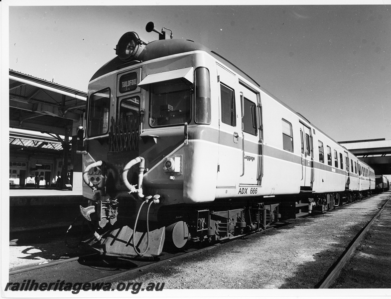 P10941
ADX class 666 diesel mechanical railcar, together with an unidentified ADA class trailer car at Perth Station. Three quarter front band side view.
